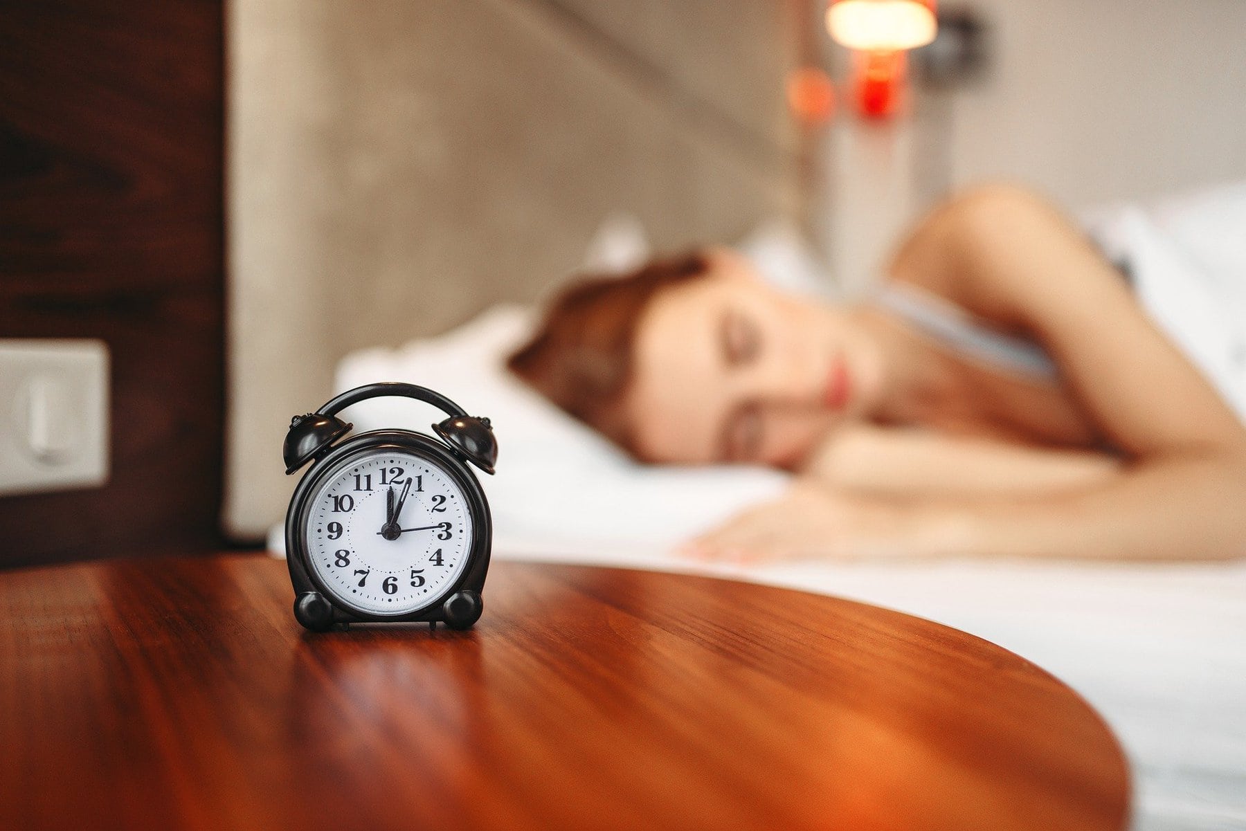 women wake up to alarm clock